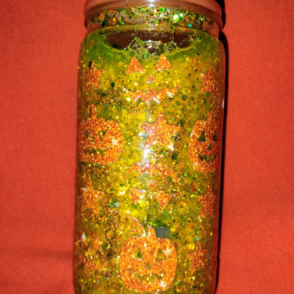 Glittery Green Snowglobe Cup with Orange Pumpkins